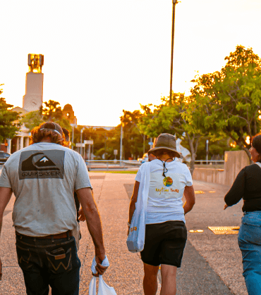 Group of people walking together at sunset, illustrating the personalised experience of a private tour with Anytime Tours.